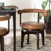 Baxton Studio Delacruz Swivel Dining Chair - Round Open Back Accent Chair with Faux Leather Upholstery, Modern Contemporary Seating for Kitchen or Dining Room - BSOBBT5547-Tan/Black-Armchair-DC